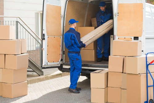 Removal van service supporting a Docklands home move near modern apartment buildings