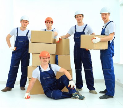 Removal van team preparing equipment safely before a move