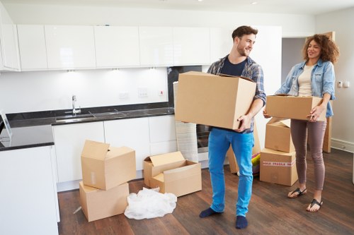 Removalists loading household furniture for a Docklands apartment move