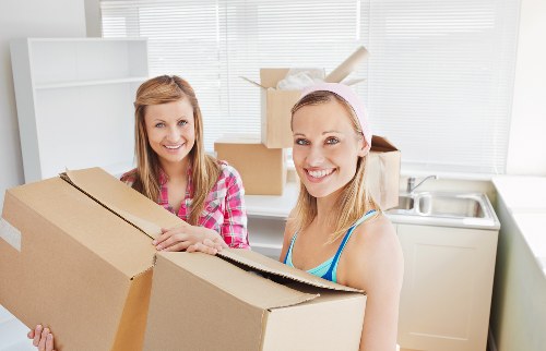 Packed boxes and furniture prepared for a local Docklands house removal