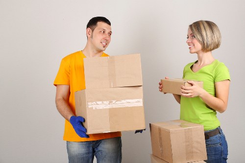 Office furniture relocation in Docklands with trolleys and protective wrapping